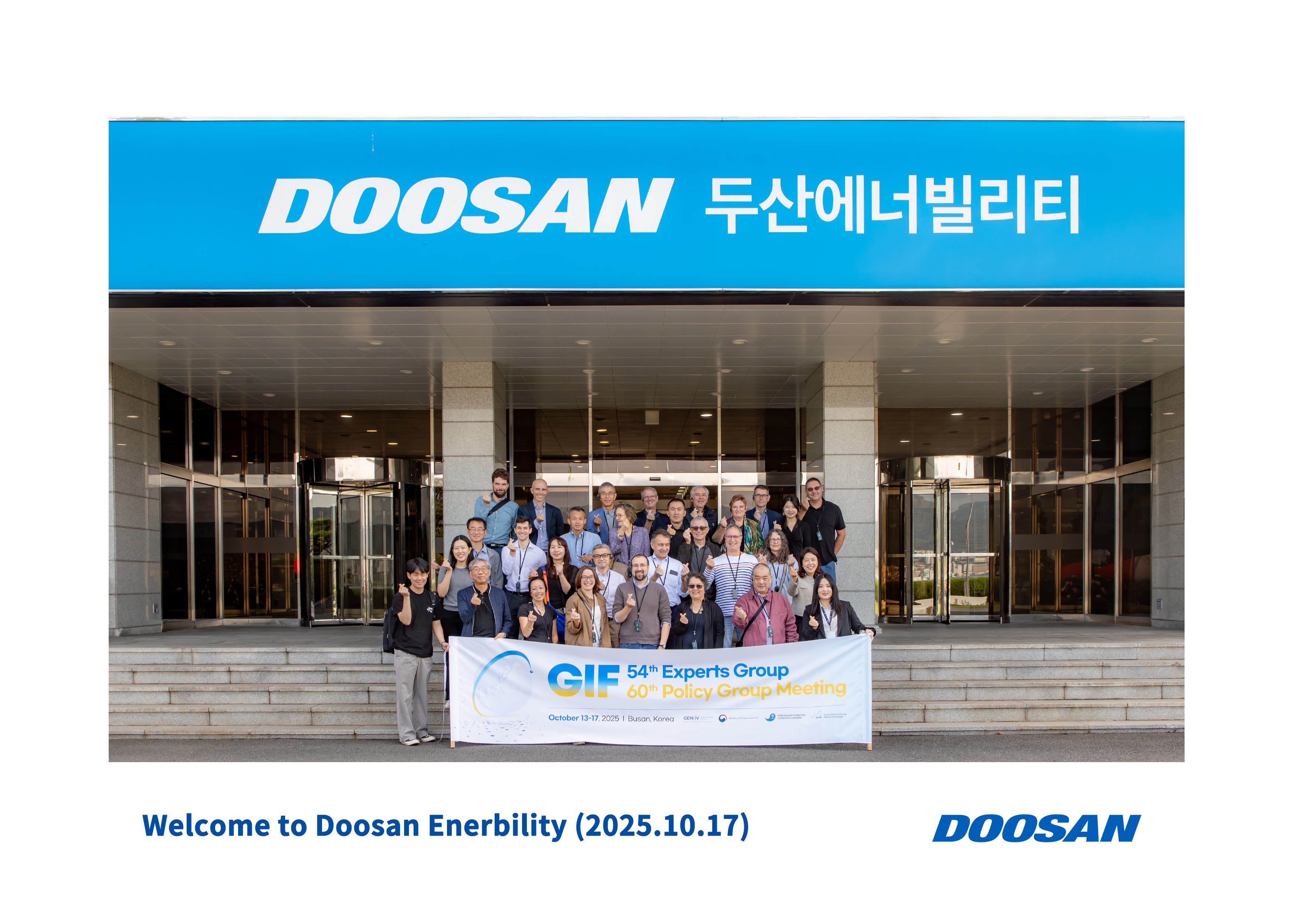 Group photo in front of Doosan Energibility sign